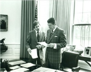 David Fischer, left, speaks with former President Ronald Reagan. Fischer, a member of the law school's 1973 charter class, worked as President Reagan's executive assistant during his presidency.