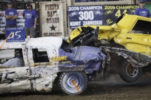 Cars crash into each other at the Utah County Demolition Derby as the drivers fight for a shot at the grand prize. Photo by Elliott Miler