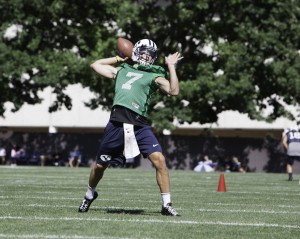 Christian Stewart, quarterback, gets ready to pass in drills on the first day of practice. Photo by Elliott Miller