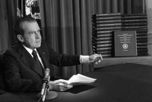 In this April 29, 1974 file photo, President Richard M. Nixon points to the transcripts of the White House tapes after he announced during a nationally-televised speech that he would turn over the transcripts to House impeachment investigators, in Washington. The last 340 hours of tapes from Nixon's White House were released Wednesday, Aug. 21, 2013, along with more than 140,000 pages of text materials. (AP File Photo)