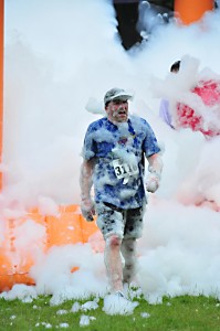 Runners get covered in foam during the Foam Fest run. (Photo courtesy of Round House Racing)