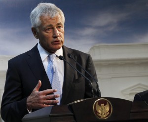 This Aug. 26, 2013 file photo shows Defense Secretary Chuck Hagel speaking in Jakarta, Indonesia. U.S. forces are now ready to act on any order by President Barack Obama to strike Syria, U.S. Hagel said Tuesday.The U.S. Navy has four destroyers in the eastern Mediterranean Sea positioned within range of targets inside Syria, as well as U.S. warplanes in the region, Hagel said in an interview with BBC television during his visit to the southeast Asian nation of Brunei. (AP Photo by Achmad Ibrahim)