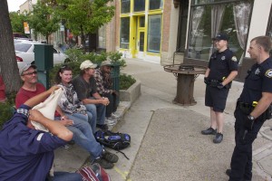 Panhandlers talk to Provo Police along Center Street. (Photo by Andrew Williamson)