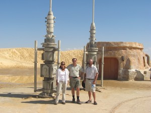 From left, BYU geologist Jani Radebaugh, Ralph Lorenz of John Hopkins University and Jason W. Barnes of the University of Idaho stand in front of a Star Wars set in September 2009. (Photo courtesy University Communications)
