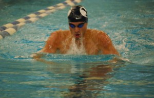 Rafael Alfaro swims in the blue/white scrimmage preparing for the 2013 season. Photo by Maddi Dayton.