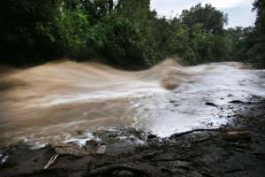 Boulder Creek roils at high speed after days of record rain and flooding, at the base of Boulder Canyon, Colo., Friday Sept. 13, 2013 in Boulder. (AP Photo/Brennan Linsley)