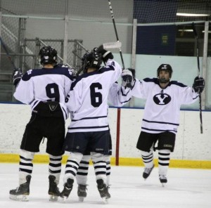 BYU hockey players celebrate a goal during the 2012-2013 season. The Cougars hope for a rebound season in 2013-2014 under new coach 