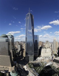 One World Trade Center overlooks the wedge-shaped pavilion entrance of the National September 11 Museum. (AP Photo)