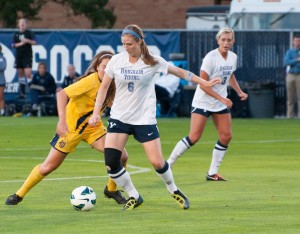Senior midfielder Rachel Manning tries to shield the ball from a UC Irvine defender during Saturday's game at South Field. Photo by Natalie Stoker
