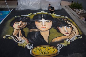One of the four featured artists was inspired by faces for this chalk mural. Photo courtesy of Shops at the Riverwoods.