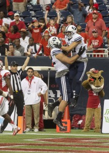 Skyler Ridley celebrates his game-winning touchdown against Houston with teammates in the end zone. Photo courtesy BYU Photo.