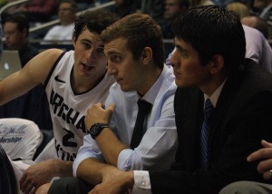 Chase Fischer talks with teammate Matt Carlino during the Nov. 2 basketball game versus Alaska Anchorage. Fischer is sitting out this season due to transfer rules, but is expected to be a major perimeter threat in 2013-14. Photo by Maddi Dayton