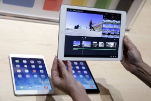 iPad Air, top right, iPad mini, bottom left, on Tuesday, Oct. 22, 2013, in San Francisco. (AP Photo/Marcio Jose Sanchez)