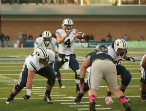 Taysom Hill gets the snap during the victory over Utah State. Photo by Ari Davis.
