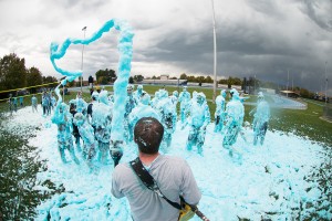 Fans are sprayed with blue foam during Wednesday's True Blue Foam day.