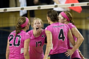 Tia Withers Welling celebrates a point with hear teammates during a match against Santa Clara. Photo by Sarah Hill