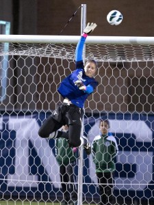 Erica Owens makes a leaping save during a recent BYU home game. Photo courtesy Jaren Wilkey/ BYU Photo