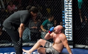 MMA fighter Jan Jorgensen protests with referee _____ after falling to the mat with an eye injury. Photo courtesy Rob Norbutt