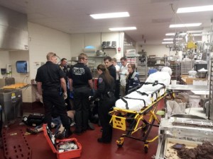 BYU police, EMTs, Provo paramedics and employees at the Culinary Support Center all work together to resuscitate David Moody.  Photo courtesy BYU Police 
