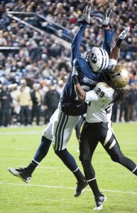 BYU wide receiver Cody Hoffman reaches up to catch a touchdown pass from Riley Nelson while being defended by Idaho corner back Matthew Harvey on Saturday at LaVell Edwards Stadium.  The Cougars beat the Vandals 42-7. (Luke Hansen)