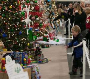 People admire the donated decorations at the Festival of Trees (photo courtesy of the Festival of Trees).
