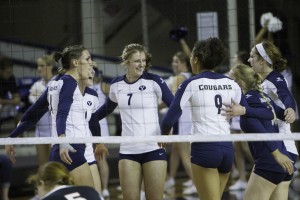 The women's volleyball team celebrates a point against Portland. Photo by Sarah Hill