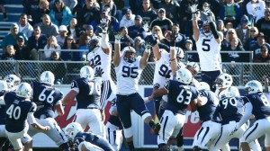 BYU defenders successfully try for a blocked field goal against Nevada. The Cougars defeated the Wolfpack, 28-23. Photo courtesy Mark Philbrick / BYU Photo