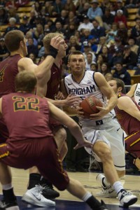 Kyle Collinsworth drives to the basket against multiple Colorado Mesa defenders during BYU's win. Photo by Ari Davis