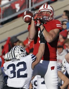 Brigham Young's Mike Hague (32) breaks up a pass intended for Wisconsin's Jordan Fredrick during the first half of an NCAA college football game on Saturday, Nov. 9, 2013, in Madison, Wis. AP Photo by Morry Gash