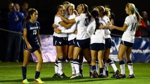 The women's soccer team celebrates Marissa Nimmer's goal as BYU prevailed 1-0 in its fifth straight shutout. Photo courtesy Mark Philbrick/ BYU Photo