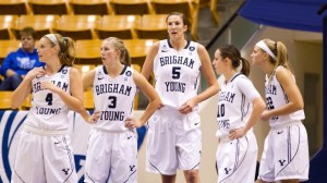BYU women's basketball players take a rest during a recent home game. Photo by Jaren Wilkey/ BYU Photo