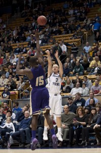 Tyler Haws sinks a three-point shot to start the Cougars off hot. Haws scored 13 of the teams' first 15 points. Photo by Natalie Stoker.