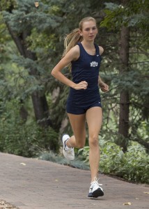 Danica Wyson runs at a cross-country meet during the 2012 season. Wyson is currently rehabilitating a shin injury, but has stayed involved with the team and plans to return in time for next season. Photo courtesy Mark Philbrick/ BYU Photo