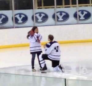 BYU hockey captain Brendan Hubbard proposes to his girlfriend during the BYU v. Utah hockey game. Photo courtesy BYU Hockey.