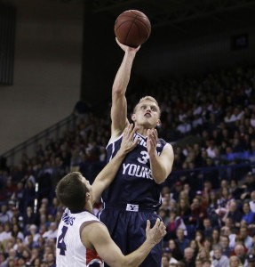 Tyler Haws attempts a jump shot against Gonzaga's Kevin Pangos during the second half the game in Spokane on Jan. 25. Gonzaga won 84-69. Photo courtesy AP Photo/Young Kwak.