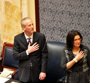 Senate President Wayne Niederhauser, R-Sandy with hand over heart pledging allegiance to the flag.