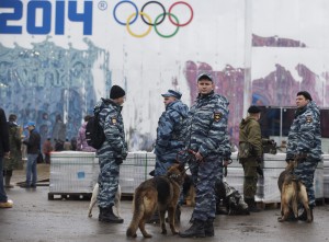Russian police patrol with their dogs inside the Olympic Park as preparations continue for the 2014 Winter Olympics in Sochi, Russia. (AP Photo/Pavel Golovkin)