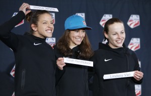 Park City native Sarah Hendrickson (center) represents the U.S. in the first Olympics including women's ski jumping. AP photo