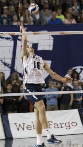 Tim Dobbert jumps to strike the ball over the net during the BYU vs. Pacific volleyball game earlier this season. Photo by Natalie Stoker