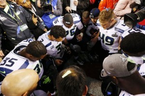 Members of the Seattle Seahawks pray after the NFL Super Bowl XLVIII football game against the Denver Broncos Sunday, Feb. 2, 2014, in East Rutherford, N.J. The Seahawks won 43-8. (AP Photo)