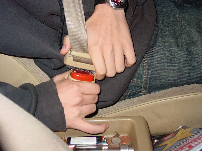 A man buckling his seat belt Photo credit: Jusmar of Wikimedia Commons