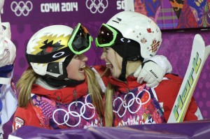 Canada's Justine Dufour-Lapointe, right, is congratulated by her sister, Chloe, after taking first place in the women's moguls final at the 2014 Winter Olympics, Saturday, Feb. 8, 2014, in Krasnaya Polyana, Russia. Justine won the gold medal and Chloe took the silver. (AP Photo/Jae C. Hong)