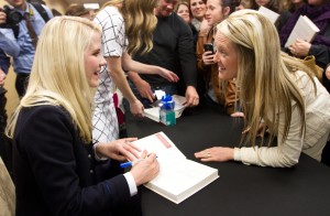 Elizabeth Smart signs books and talks to fans after speaking at the Heritage School on Thursday evening. (Photo by Sarah Hill.)