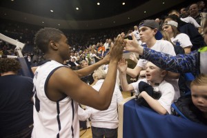 Anson Winder gives high-fives to fans after a game against the Saint Mary's Gaels. Photo by Elliott Miller