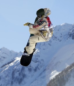 United States' Sage Kotsenburg takes a jump during the men's  snowboard slopestyle final at the Rosa Khutor Extreme Park, at the 2014 Winter Olympics, Saturday, Feb. 8, 2014, in Krasnaya Polyana, Russia. (AP Photo/Sergei Grits)