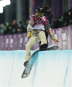 Shaun White of the United States hits the edge of the half pipe during the men's snowboard halfpipe final at the Rosa Khutor Extreme Park, at the 2014 Winter Olympics, Tuesday, Feb. 11, 2014, in Krasnaya Polyana, Russia. (AP Photo/Andy Wong)