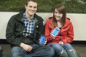 BYU students Erik Jackson and Amanda Cherrington showcase their personal smartphones. While technological advances have simplified user lives, over-reliance on digital devices may be shortchanging the development of other essential skills among college students. (Photo by Maddi Dayton.)