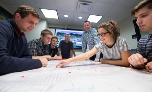Director Jeff Sheets (third on right, standing) and students collaborate while creating the Virtual Tour of BYU Campus. This is an example of one of many projects students can get involved with at the Center. (Photo courtesy of Laycock Center for Creative Collaboration.)