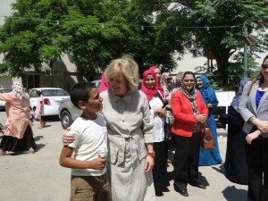 Ambassador Jones interacts with a young Libyan boy. Jones said she is committed to helping Libya through its "democratic evolution."