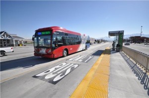 A Bus Rapid Transit vehicle pulls up to a stop on route, demonstrating the use of bus only lanes associated with BRT systems. Photo Courtesy of Utah Transit Authority